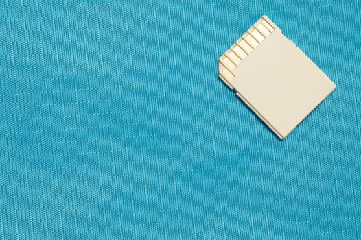Memory card isolated on blue background. Sd card and copy space