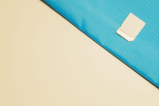 Memory card isolated on blue background. Sd card and copy space