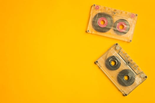 Retro cassette tape on the yellow background. copy space