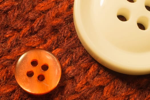 Buttons on red textile background. macro view. copy space