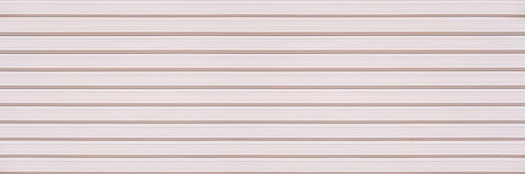 Abstract white pink brick wall texture background. Horizontal panoramic view of masonry brick wall for interior design.