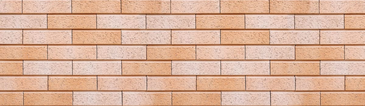 Abstract pastel brick wall texture background. Horizontal panoramic view of masonry brick wall for interior design.