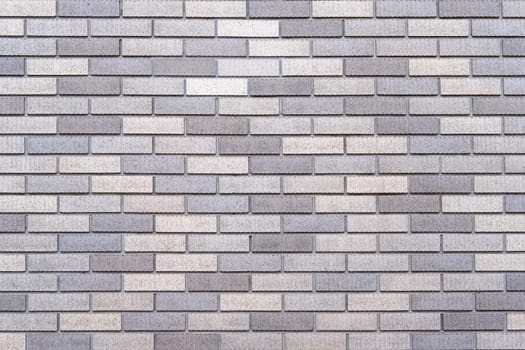 Abstract gray brick wall texture background. Horizontal view of masonry brick wall for interior design.