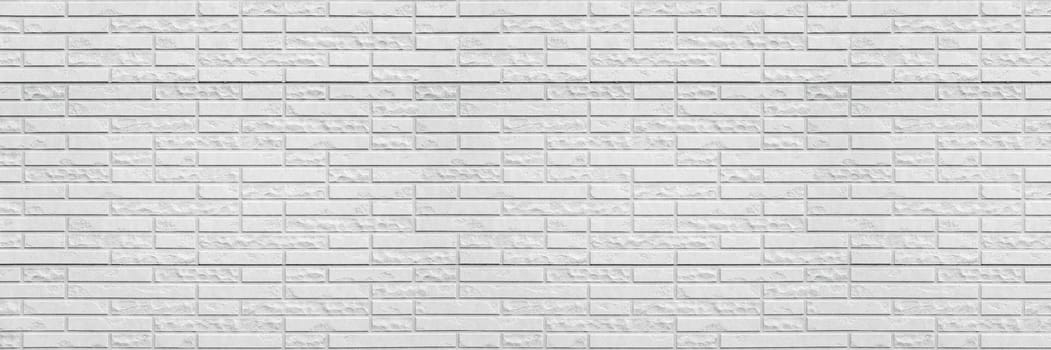 Abstract white brick wall texture background. Horizontal panoramic view of masonry brick wall for interior design.