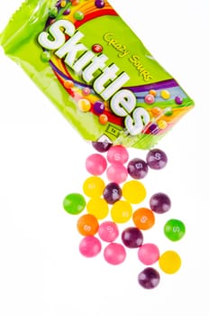 Skittles fruit-flavoured candies isolated on white background. Nowadays Skittles produced and marketed by the Wrigley Company Wrigley Company a division of Mars Incorporated, USA.