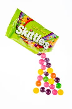 Skittles fruit-flavoured candies isolated on white background. Nowadays Skittles produced and marketed by the Wrigley Company Wrigley Company a division of Mars Incorporated, USA.