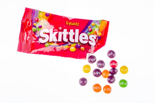 Skittles fruit-flavoured candies isolated on white background. Nowadays Skittles produced and marketed by the Wrigley Company Wrigley Company a division of Mars Incorporated, USA.