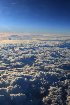 Window seat, a flight in the sunset