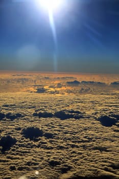 Window seat, a flight in the sunset