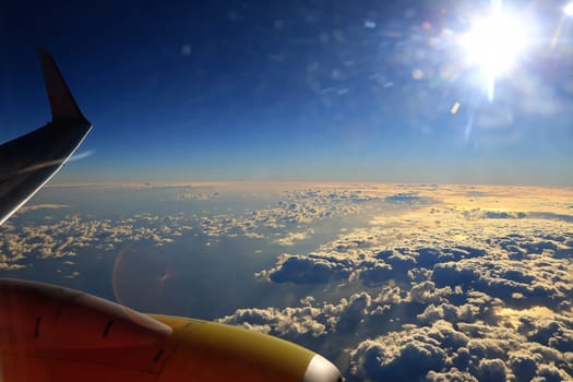 Window seat, a flight in the sunset