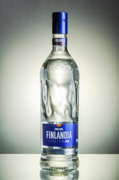 Finlandia vodka on gradient background. Finlandia vodka has been produced from barley and pure glacier water since 1970