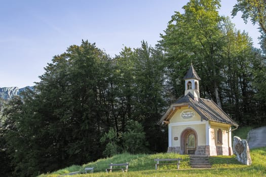 Sunlight morning view of tourist attraction small chapel in Bavarian national park Berchtesgaden