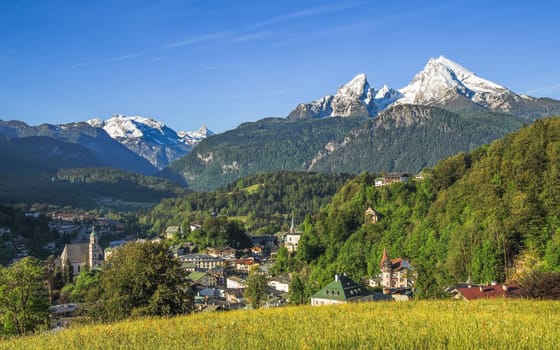 Panoramic landscape view of German small tourist town Berchtesgaden with snow-crowned Watzmann mount in Bavarian Alps