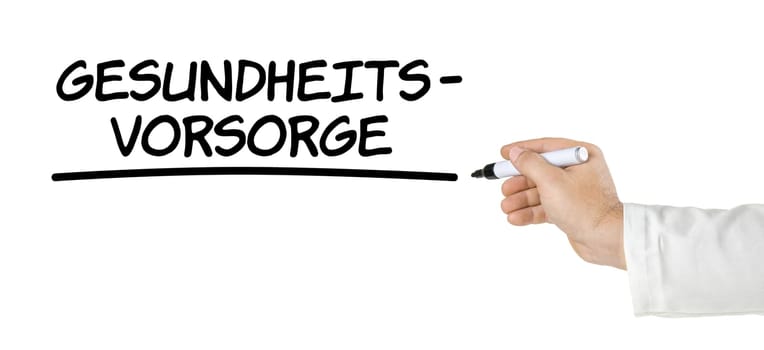 Hand with pen writes health care