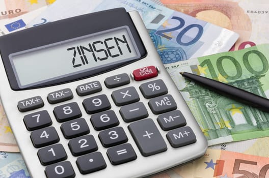 Calculator with banknotes - interest