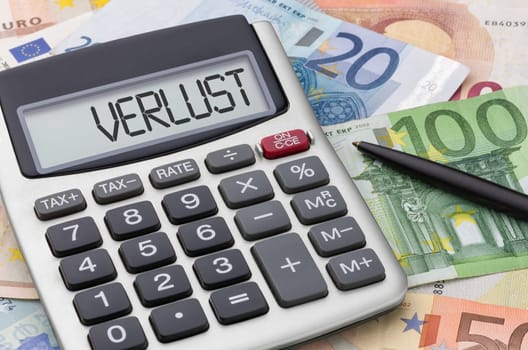 Calculator with banknotes - loss