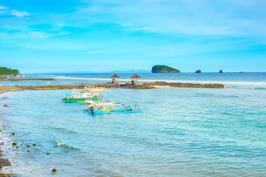 Bali island tropical seascape with traditional boats moored, Indonesia