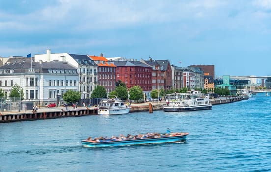 Copenhagen harbor view, boat with tourists and modern city skyline , Denmark
