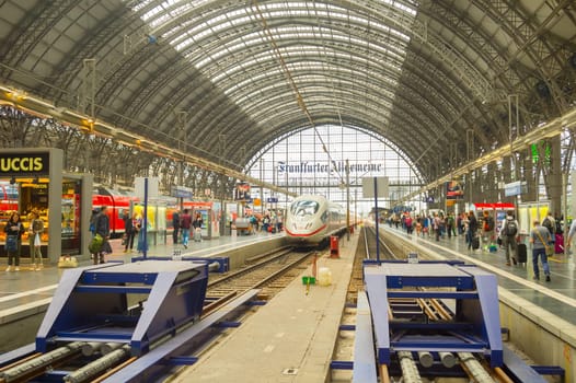 FRANKFURT, GERMANY - AUGUST 29, 2018: Modern train arrives to Frankfurt am Main Train station. People waiting for boarding