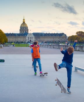 PARIS, FRANCE - NOVEMBER 9, 2018: Boys skating in the downtown of Paris in the evening, France