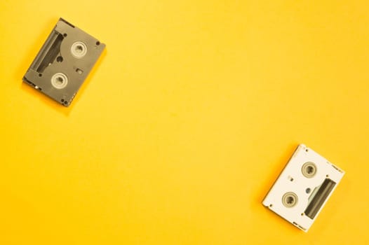 Digital video cassette on yellow background. mini cassette. copy space