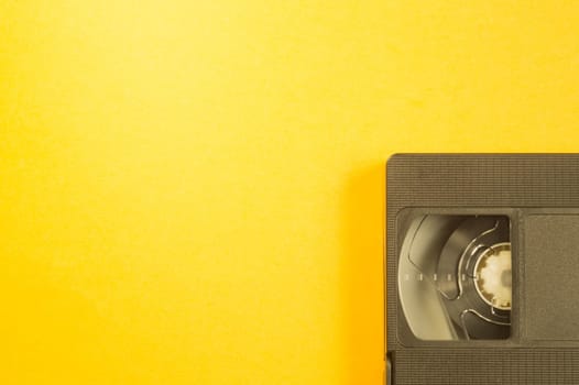 Video cassette isolated on yellow background. vhs with copy space