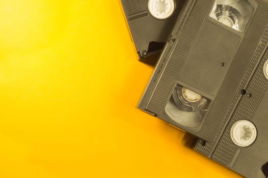 Video cassette isolated on yellow background. vhs with copy space
