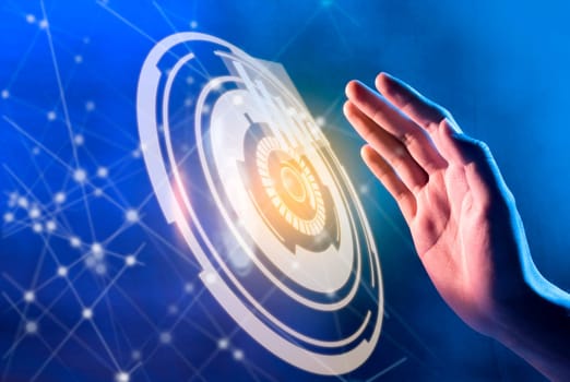 Hands of business person want to press the circles on virtual screen which display the interface of graphs and business network. Digital technology concept