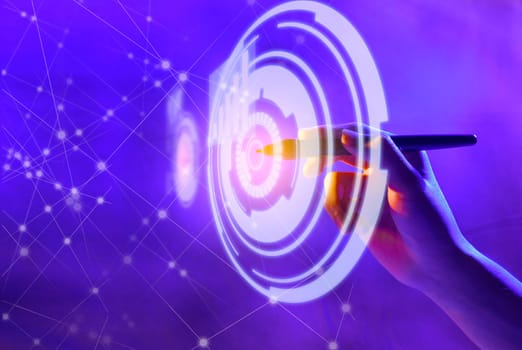 Business hand with markers touching a circle on virtual screen which display the interface of graphs and business network. Digital technology concept