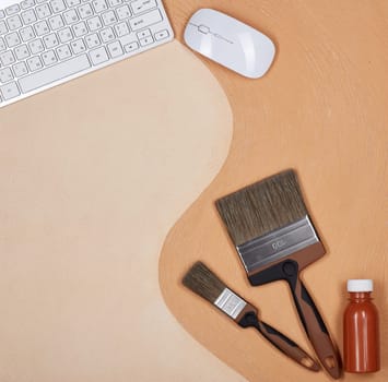 Painting accessories and computer keyboard lying on textural double background consisting of two beige shades. Top view with copy space, Concept of construction or design office. Internet shop