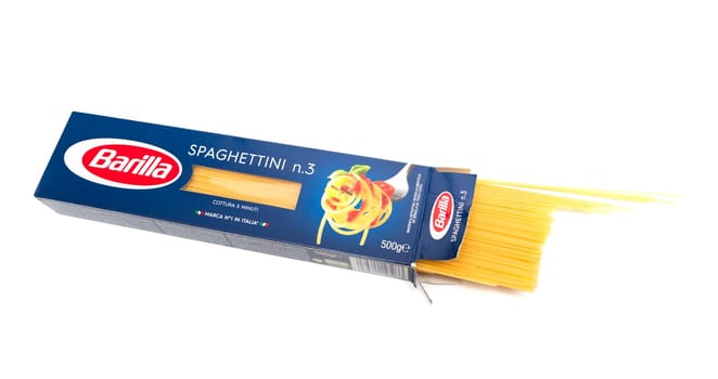 CHISINAU, MOLDOVA - Marth 21, 2018: Open packaging of Barilla Spaghetti n.3 italian pasta on white background. Barilla is a company was founded as a bakery shop in Parma, Italy by Pietro Barilla