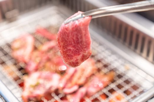 grilled japanese wagyu premium beef yakiniku with red hot charcoal