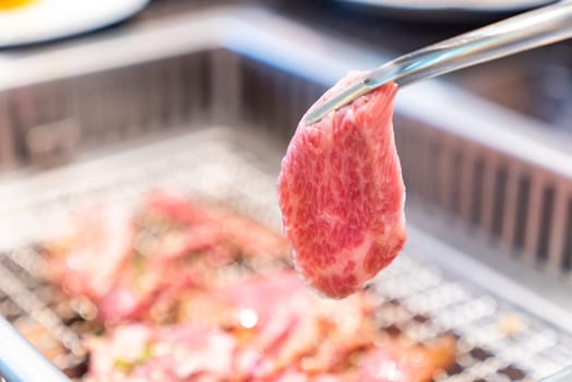grilled japanese wagyu premium beef yakiniku with red hot charcoal