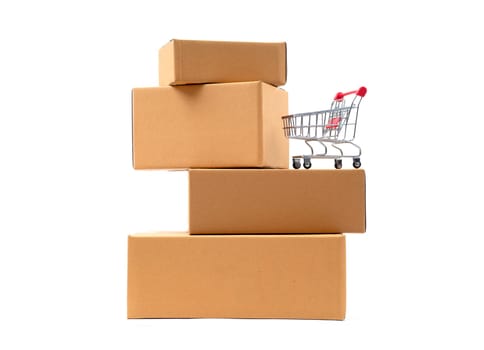 red shopping cart on brown parcels box