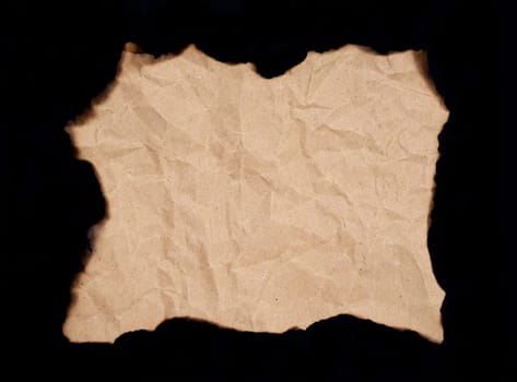 burnt paper sheet isolated on black background