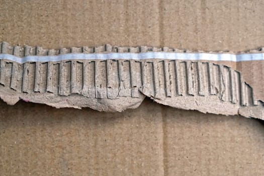 Pull to open strip at cardboard box