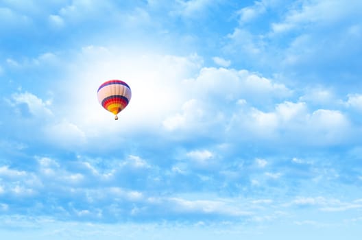 Hot air balloon flying in a blue sky
