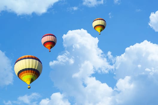 Hot air balloon flying in a blue sky