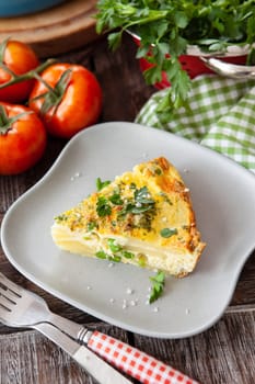Delicious baked fritatta with peas, potatoes and fresh parsley