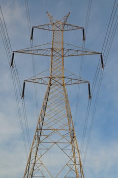 Transmission tower electricity pylon steel industrial structure and power lines.