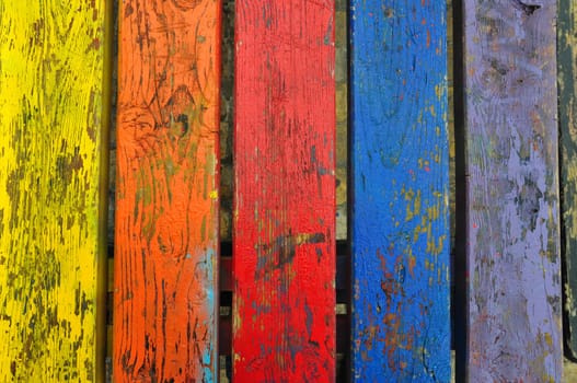 Chipped paint wood texture colorful planks weathered wooden boards abstract background.