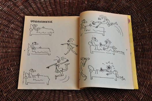 ATHENS, GREECE - JANUARY 7, 2015: Comic strip by cartoonist Georges Wolinski (1934 - 2015) one of the victims of the terrorist attack at the headquarters of Charlie Hebdo newspaper on January 7, 2015 in Paris, France.