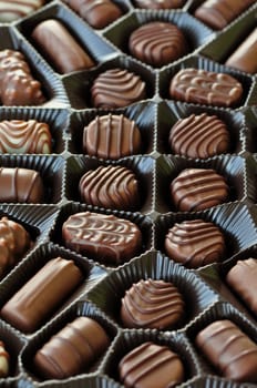 Box of chocolates sweet food candy background. Selective focus.