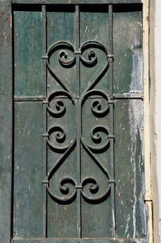 Paint stained rusty iron door background with vintage abstract motif.