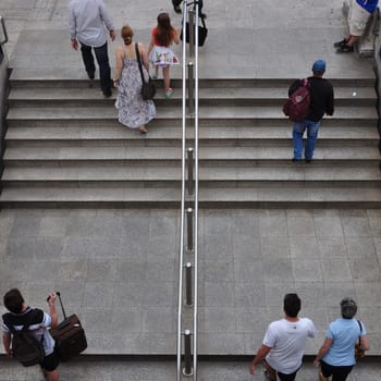 ATHENS, GREECE - JUNE 9, 2014: People walking up the stairs of Syntagma metro station. Daily life street scene in downtown Athens, Greece.