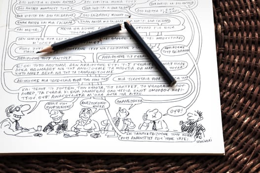 ATHENS, GREECE - JANUARY 8, 2015: Broken pencil on comic strip by cartoonist and writer Georges Wolinski (1934 - 2015) one of the victims of the terrorist attack at the headquarters of Charlie Hebdo newspaper on January 7, 2015 in Paris, France.