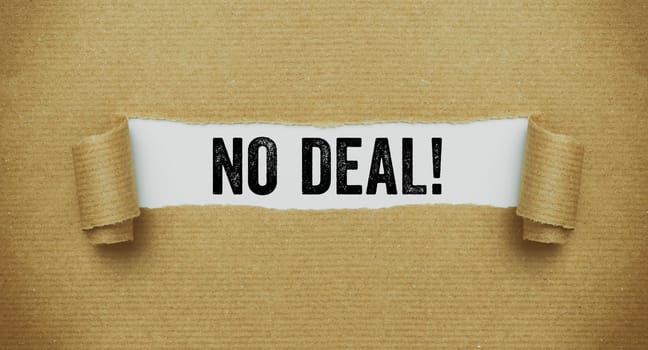 Torn brown paper revealing the words No deal