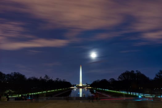 Washington Monument in new reflecting pool from Lincoln Memorial at sunset. Washington DC USA