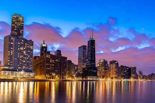 Sunset at Chicago Skylines building at Chicago downtown along Lake Michigan in Chicago City Illinois USA. Take from Ohio Street beach Milton Lee Olive Park.