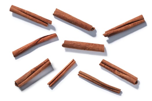 Cinnamon or cassia sticks (dried bark) isolated on white, top view